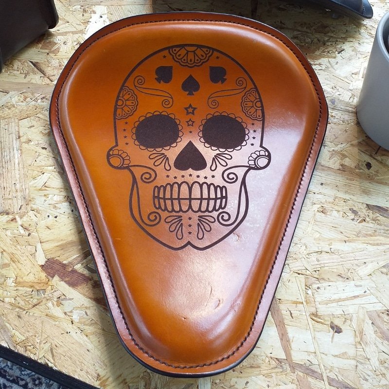 Laser etching onto leather. Contact us with any ideas you have of designs we can put onto our lone rider seats. 
#bobber #custom