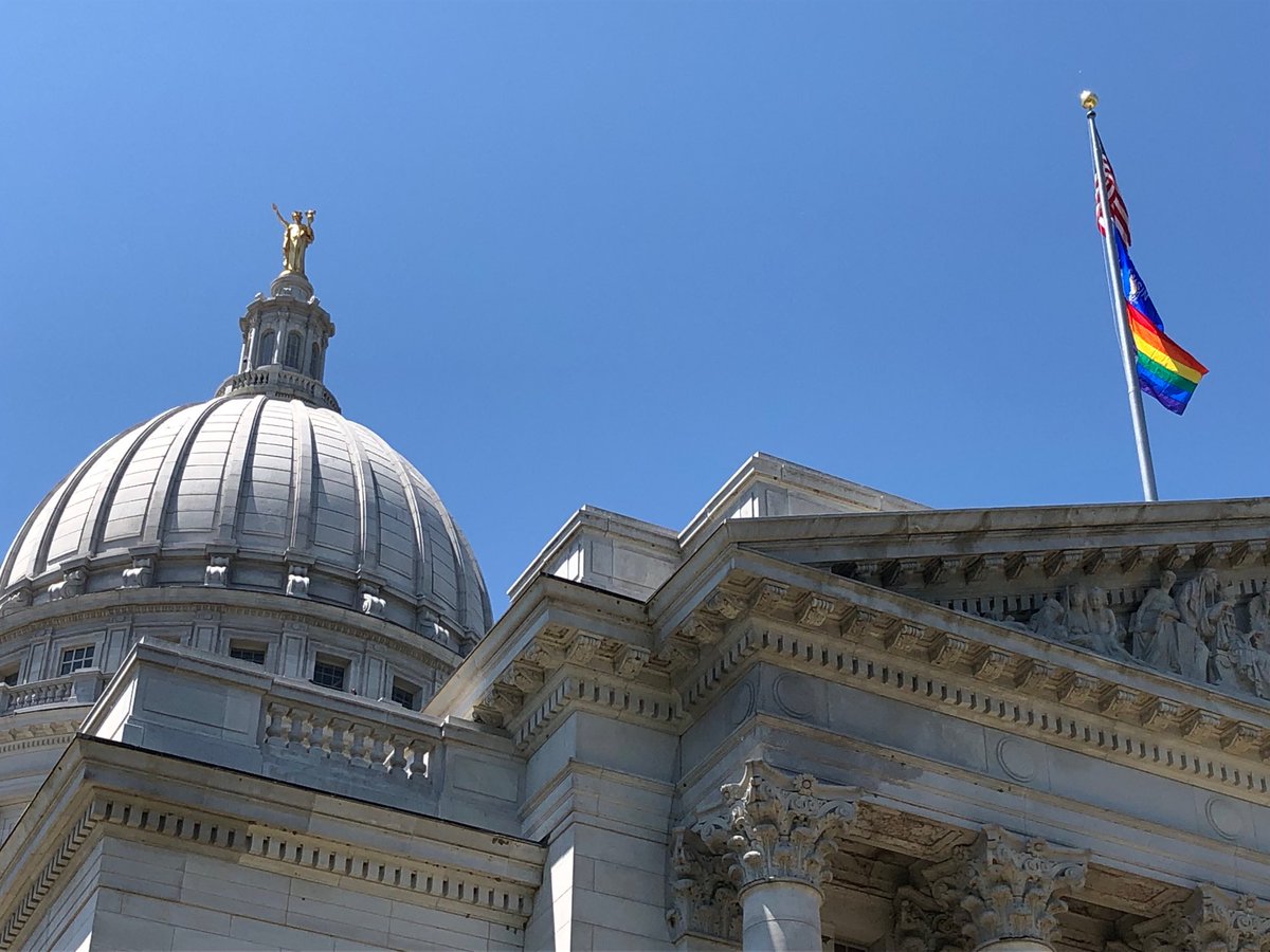 Gay pride rainbow flag raised over Wisconsin state Capitol for the first time. Crowd watching below cheers as it goes up under U.S., state flags

⁦<a href="/GovEvers/">Governor Tony Evers</a>⁩ ordered it up to celebrate June as Pride Month