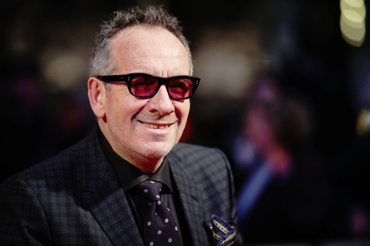 stereogum's tweet image. Elvis Costello has been named an OBE (Officer of the Order of the British Empire). In a statement he says "it confirms my long held suspicion nobody really listens to the words." 😆 gum.to/TNQlMT