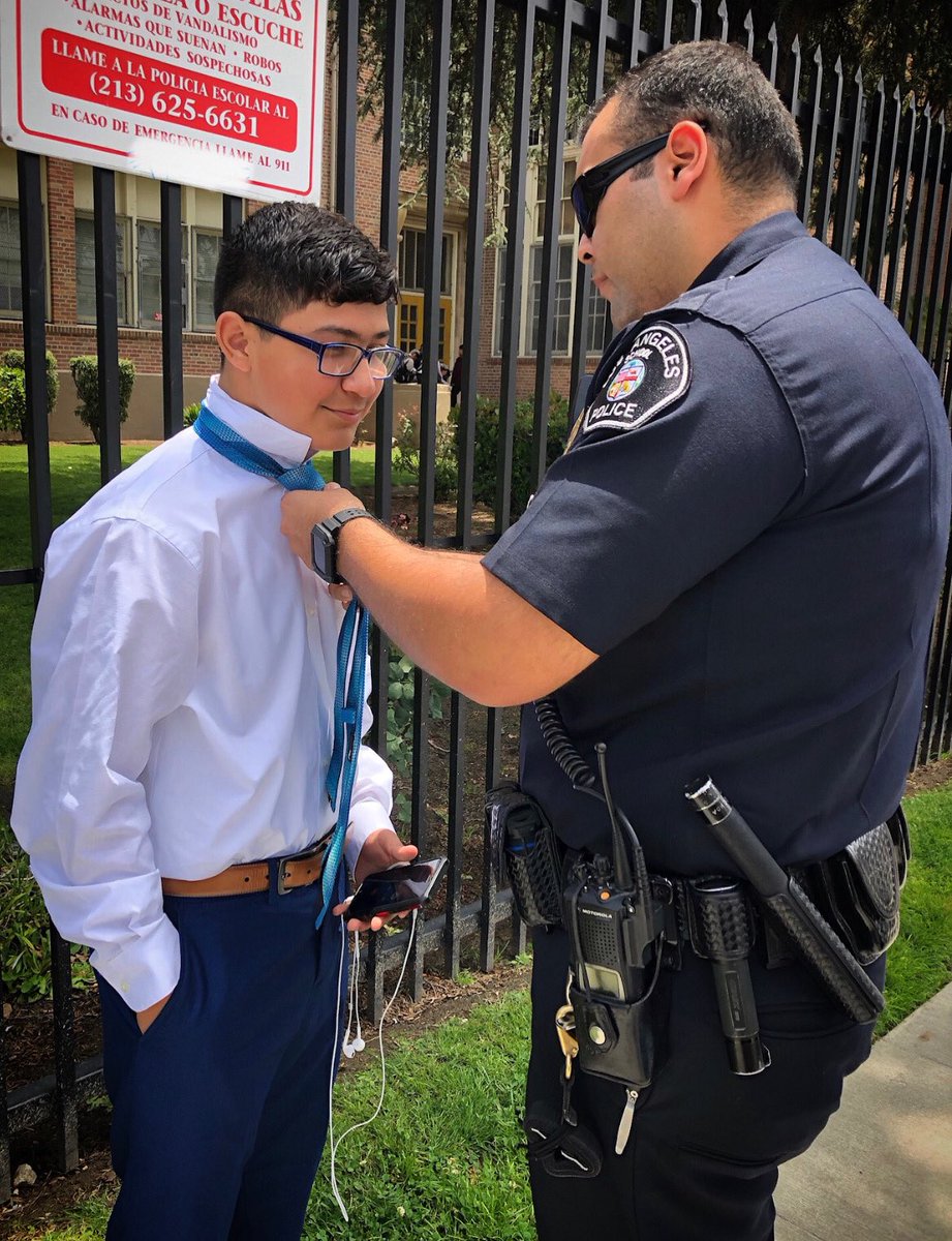 LASchoolPolice's tweet photo. When duty calls! Officer Ochoa helps out a Le Conte Middle School student right before his 8th grade culmination.
#Outstanding #LeConte #Hollywood #Classof2019 #Mentor @LASchools https://t.co/Jo8sUxFRBo
