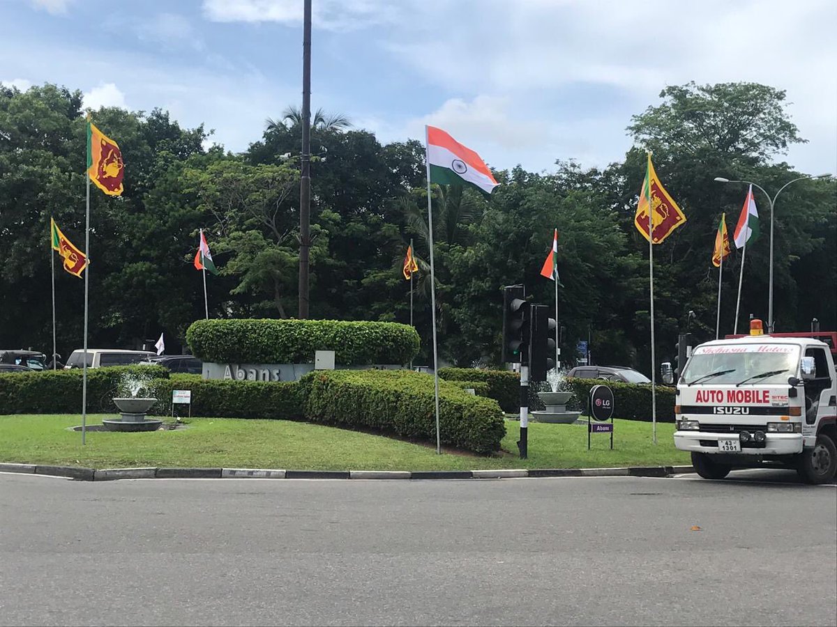 saksivarnan's tweet photo. Billboards and Indian tricolor on display in capital Colombo to welcome PM @narendramodi on his state visit tomorrow; The visit is being seen as gesture of solidarity with victims of #EasterSundayAttacksSL #lka #srilanka #ModiInSL #ModiVisitSL https://t.co/BF3WJNmqqC