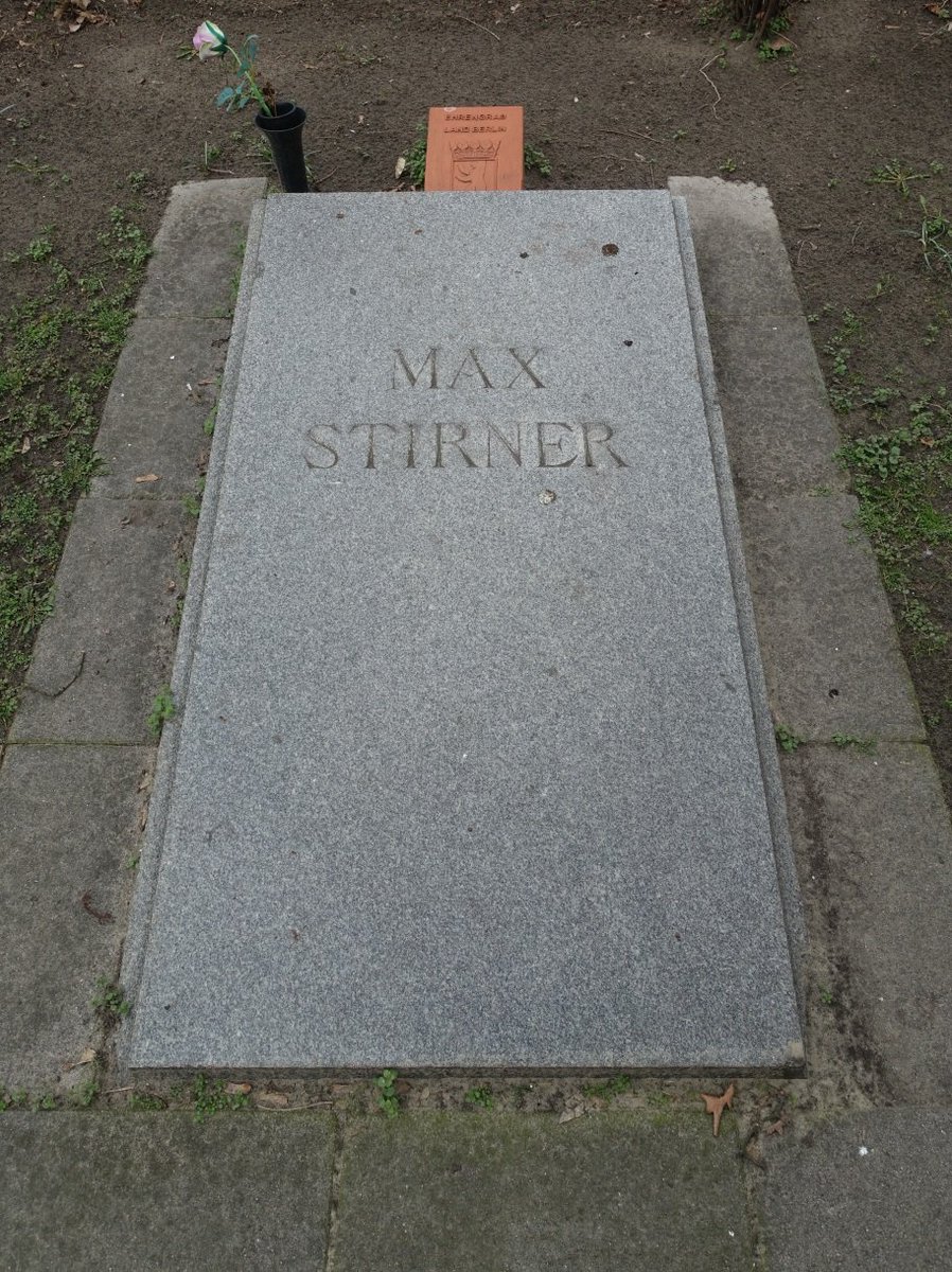 54a\\ Max Stirner's grave at the cemetery “Friedhof II der Sophiengemeinde Berlin” is rather modest. It is another honorary grave of the state of Berlin. Max Stirner was not his real name though, but a pseudonym. His real name was Johann Caspar Schmidt.