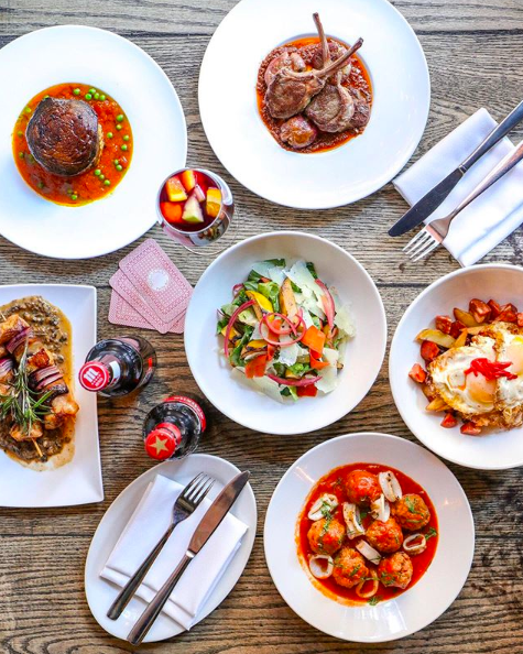 Let's admit it, food tastes better when shared with the right company.🍲 In many cultures it is a norm to eat with friend and family.👪 With who do you love to share your food?

Photo credits: <a href="/SocarratNYC/">Socarrat Paella Bar🥘</a> 
#sharingiscaring #shareddinning #plancha #antipasti #tapas