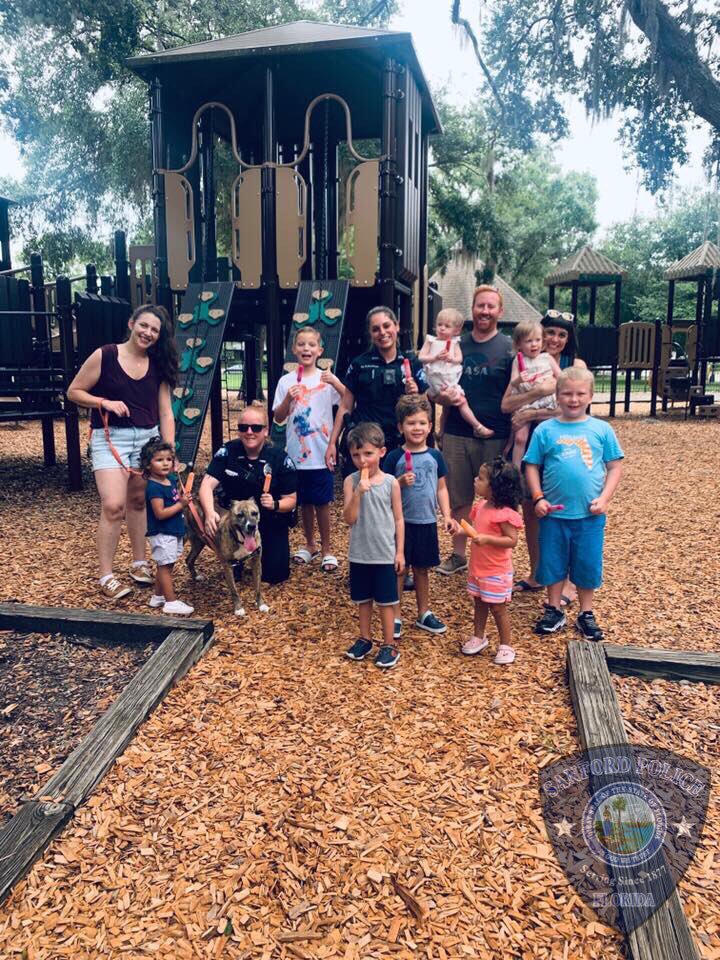 SanfordPolice's tweet photo. Officer Bradshaw and Hooper were hard at work in the heat of the afternoon. They helped spread the word on vehicle security by conducting Vehicle Safety Surveys at Park at Ravello Ave. Then it was on to #OperationCopsicle at Park on Park to cool down. #OfcHooperMayNeedAStepStool https://t.co/DSpaiTO02e