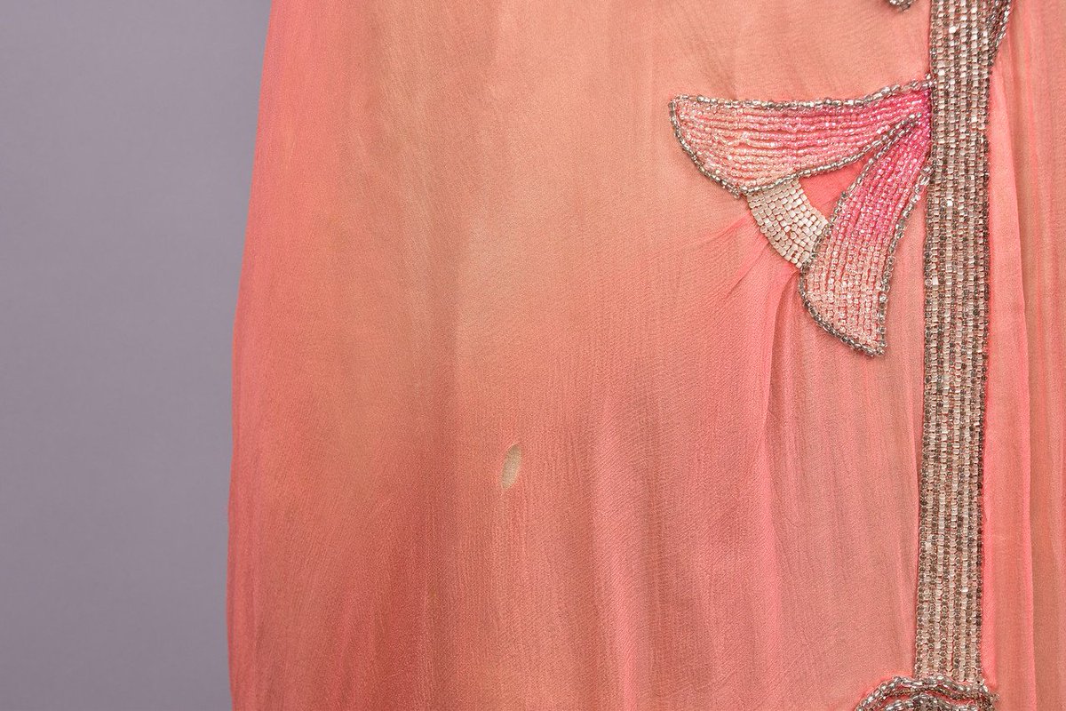 LaurenCDeutsch's tweet photo. Today's #ootd is a Worth "beaded lotus gown" from the early 1900s. The beading is so amazing, as is the way they're arranged to make a pink ombre effect.  #WhitakerAuction #FashionHistory https://t.co/AsY5HZoACM