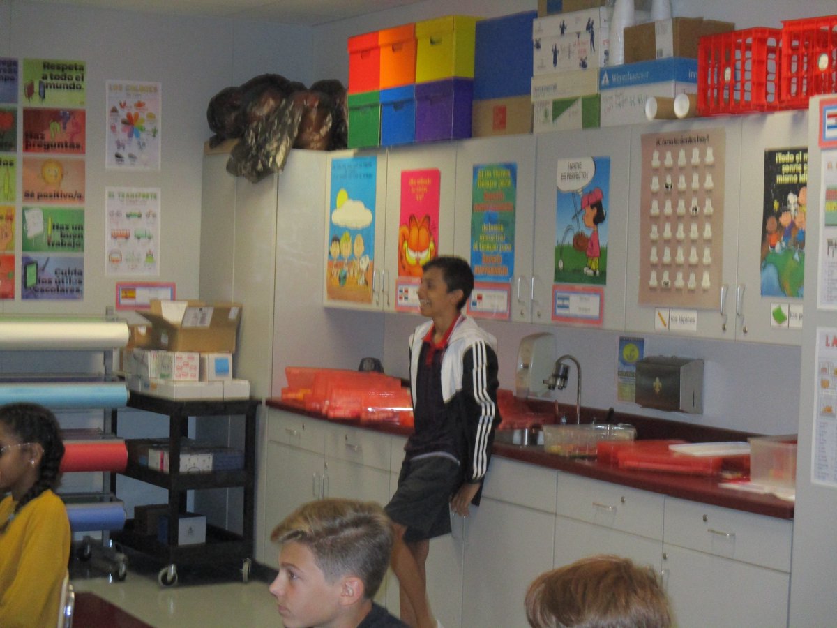 ESL students, Airon and Luis Otarola, present to Spanish classes about their home country, Costa Rica.