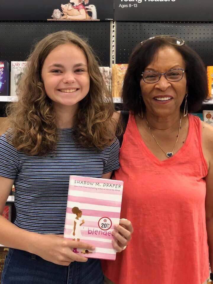 sharonmdraper's tweet photo. Chilling in ⁦⁦@Target⁩, enjoying the smooth roll of the red basket, &amp; I stop by the book section (always do!) &amp; I meet this young lady who is buying a book for summer reading. She chose BLENDED! The author happened to be standing there! We were both giddy w/ excitement! https://t.co/P3Xx4d3yoX