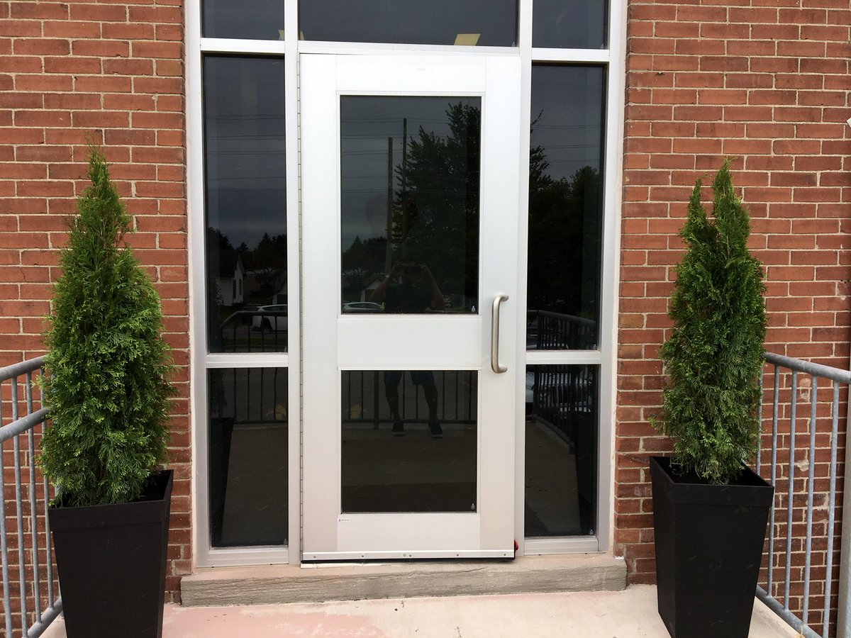 Lockes22's tweet photo. We look forward to celebrating 100 years of #lockespride with you this Friday & Saturday! Thank you to Mr. Mohan’s Gr. 1 class for planting our new trees at the Old School House entrance & our current front doors #LockesCentennial @LockesPVA @TVDSB https://t.co/OxgpwpQT34