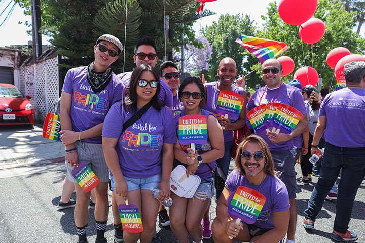 A group of employees at the Pride parade.