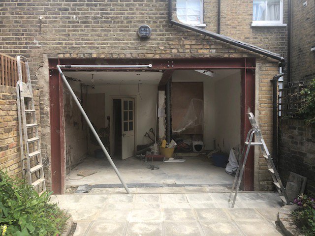 A small project in Shepherd's Bush, from a slightly compact kitchen with poor access to the rear, now fully openable to the garden.