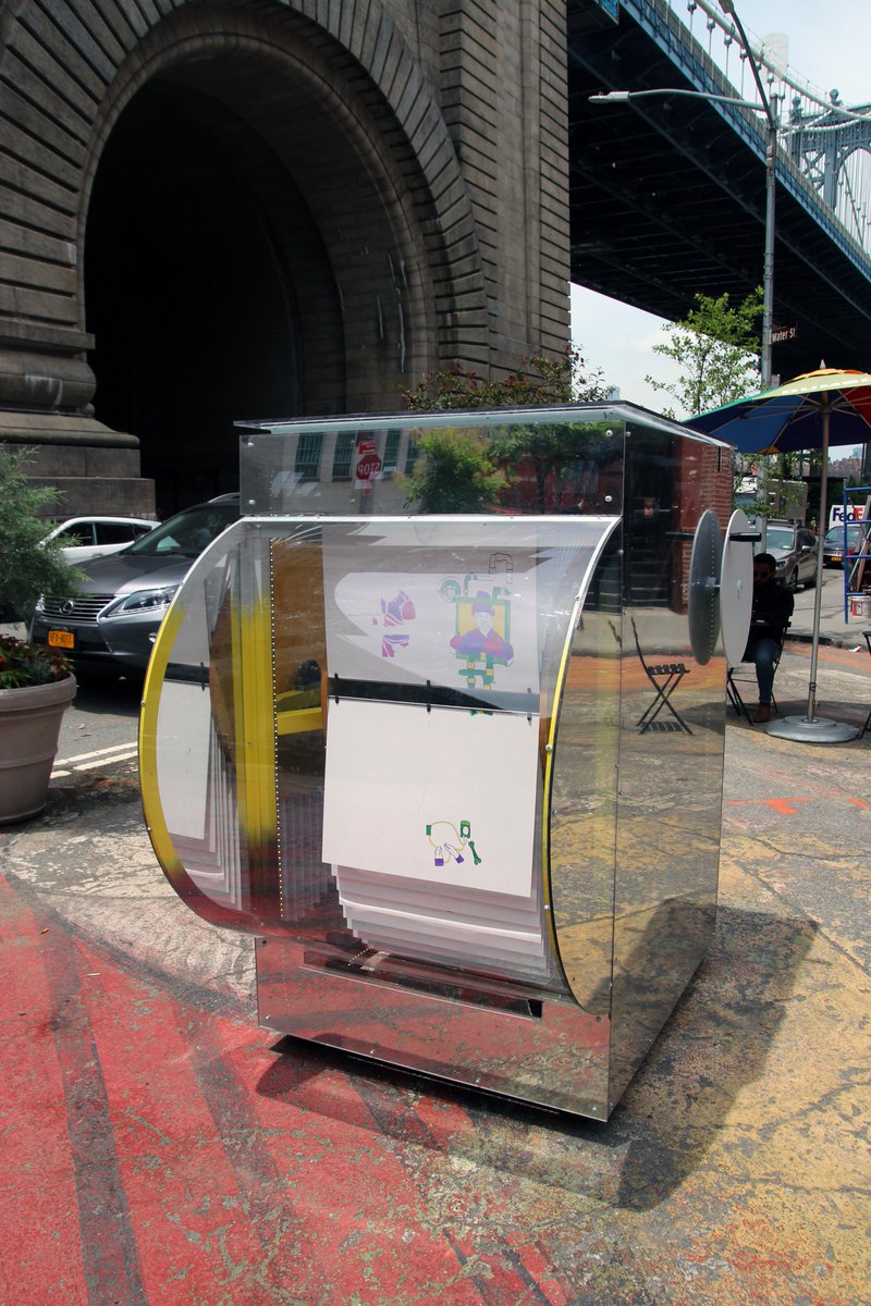 NYC_DOT's tweet photo. Give #DOTArt's newest installation, “FlipNYC”, a spin! Installed at the Pearl Street Triangle in DUMBO, Brooklyn in partnership with @DUMBOBID. “FlipNYC” by @beamcenternyc represents two of the world’s largest mechanical solar-powered Flipbooks 🎨 #Arterventions https://t.co/DneLnjvAY6