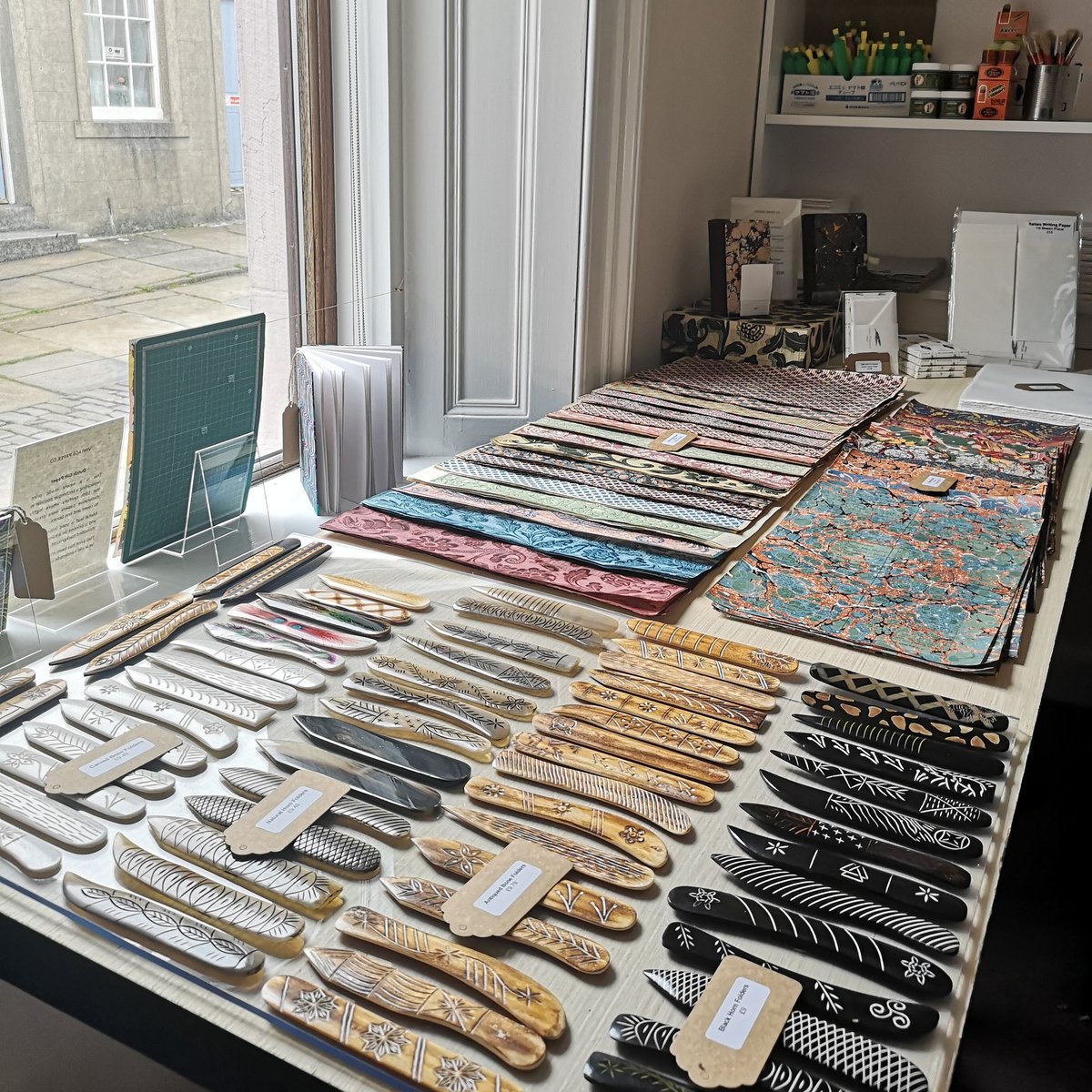 VintagePaperCo's tweet image. Perhaps the world's most ridiculous selection of hand carved and decorated bone folders on display at New VPCo Towers here in Stromness, Orkney. Playing shopkeeper.  
.
#bonefolder #bookbinding #retail