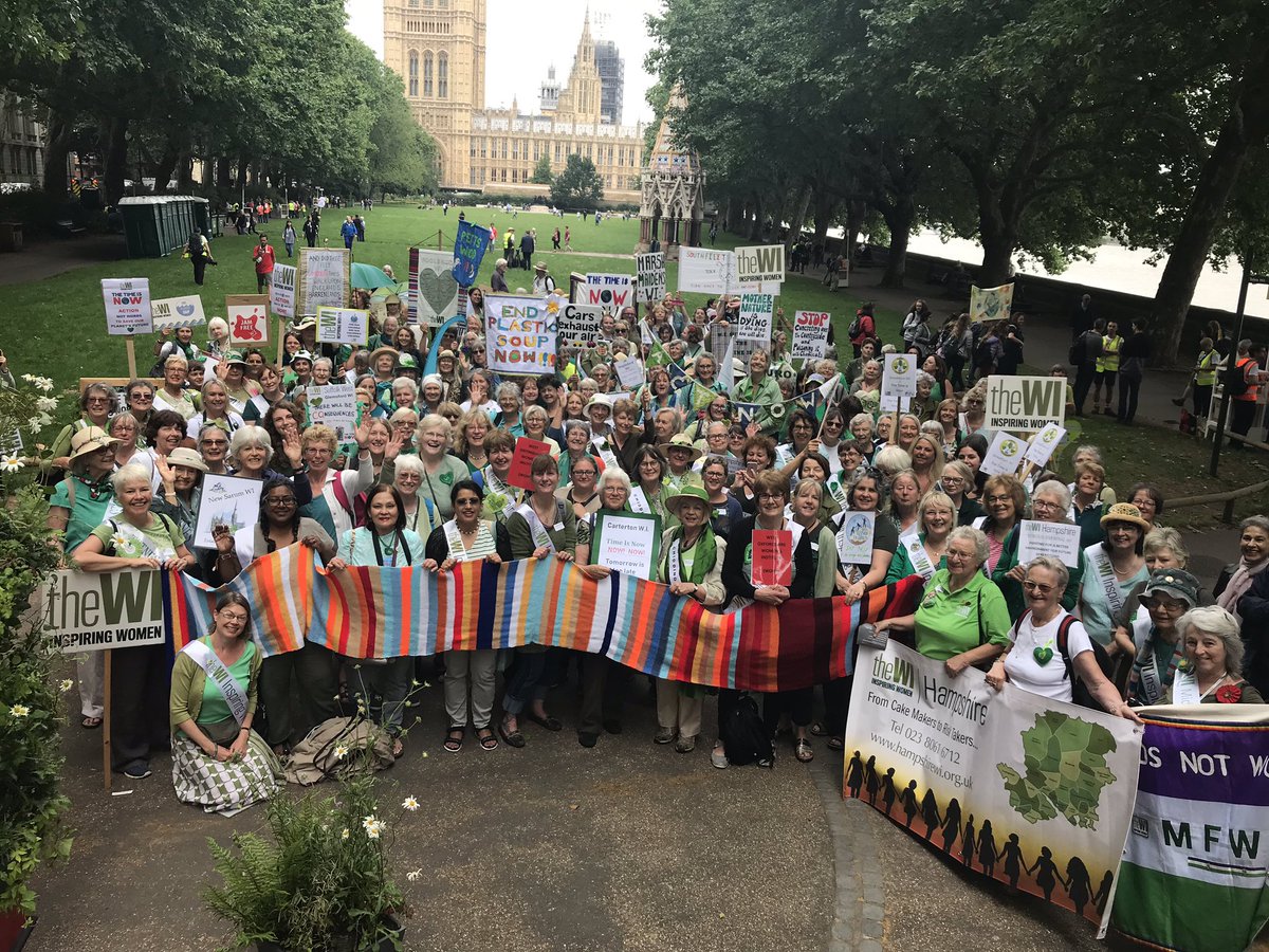 WomensInstitute's tweet photo. WI members, with @CambridgeFedWI’s 5M climate scarf, are saying #TheTimeIsNow for urgent action on #climatechange! The scarf’s stripes represent the UK’s increasing temperature from 1918-2018! https://t.co/ts6vRWBFHF