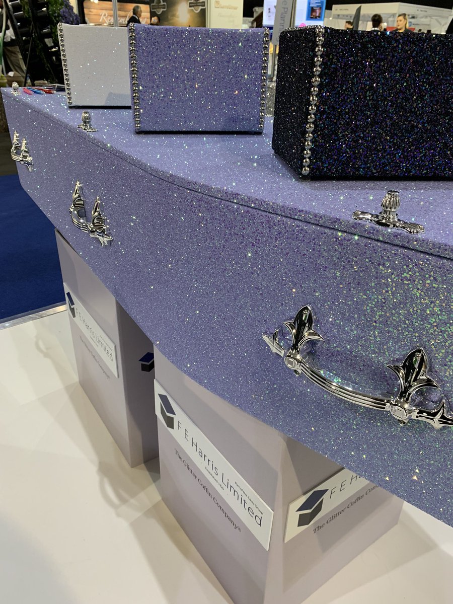 The lilac glitter coffin with silver detailing, ashes boxes on top in opal white glitter, lilac, and petrol glitter #theglittercoffincompany #glittercoffin #glittercoffins #sparkle #funeral #funeralhome #funeraldirectors