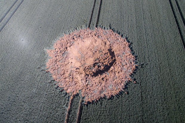 Buried WW2 bomb suddenly explodes in German field leaving giant crater dailystar.co.uk/news/world-new…