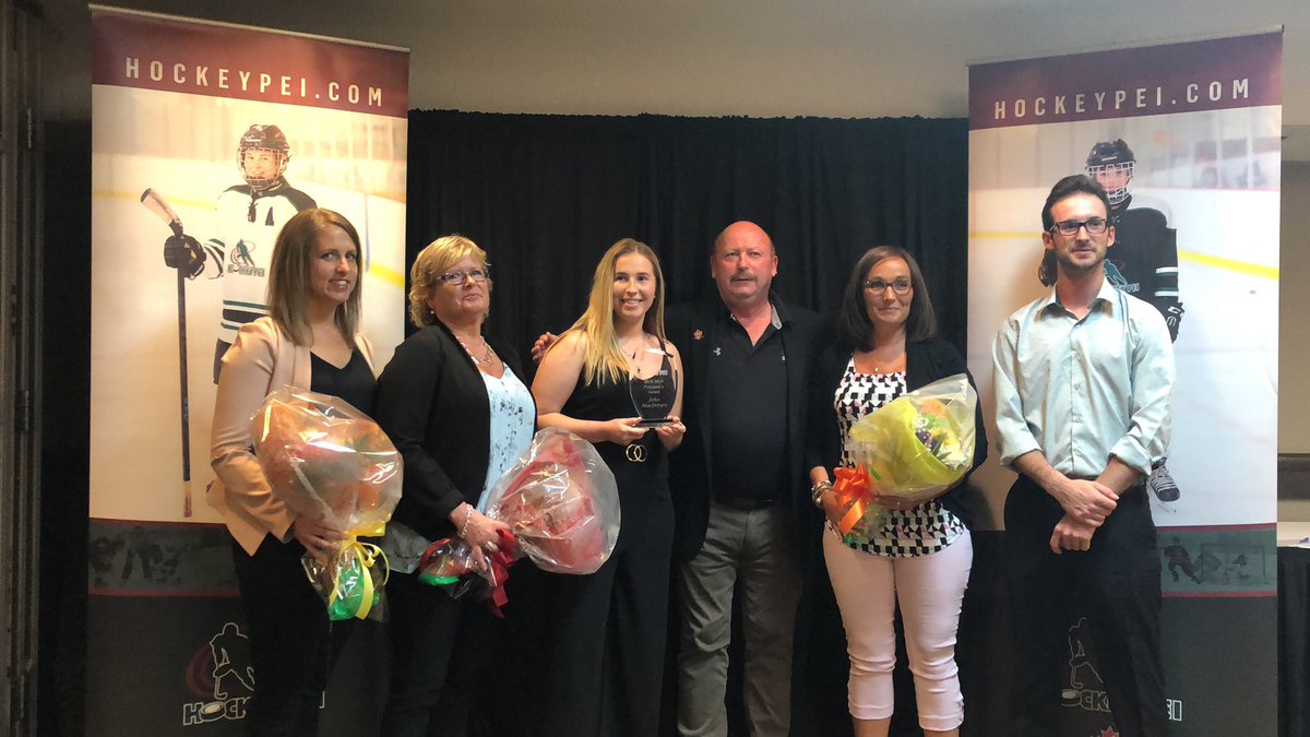 HockeyPEI's tweet photo. The President’s Award goes to the Late John MacIntyre. John gave back with numerous years of dedicated service on the Minor Council, and sadly passed away this winter. His wife, children and sisters accept on his behalf. https://t.co/ac8kM0kz0u