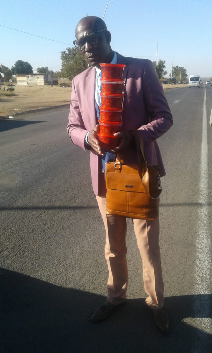 CapricornFM's tweet photo. Selling a common product, ATCHAAR. Every morning, Irvin Mashele wakes up, puts on a suit &amp; tie &amp; stands at an intersection in Soshanguve to sell his buckets from as little R20. We spoke to him as we salute his unconventional sales approach to selling Atchaar #ImmaculateBreakfast https://t.co/Oi20n5McnA