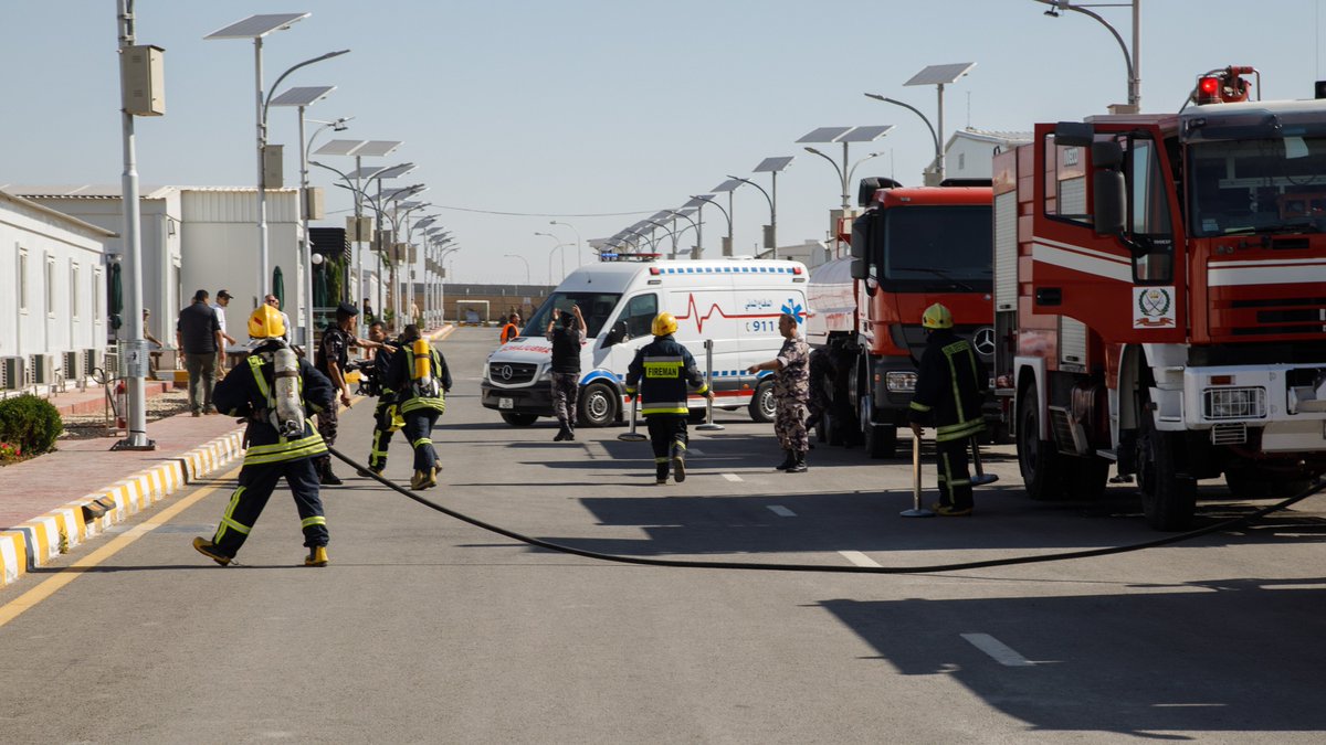 ASG_Jordan's tweet photo. Arizona National Guard Soldiers assigned to Area Support Group - Jordan and first responders from the Jordan Civil Defense Department work together during an exercise fire drill at the Joint Training Center, June 20, 2019. #partnerships #United4Readiness #FirstResponders https://t.co/DrpPLcNN3p