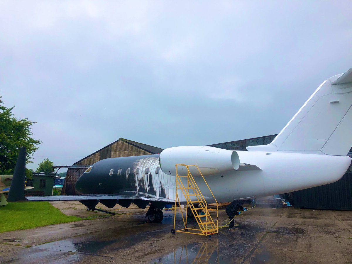 ShootAviation's tweet photo. Washing the black temporary paint from our Challenger Private Jet for a film shoot later this week. For once the rain is welcome! #ukfilm #filmproduction #locationscout #washablepaint #temporarypaint https://t.co/7g8BLKVwVN