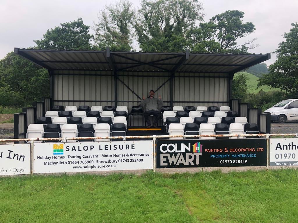 BowStreetFC's tweet photo. Great to see the new 50 seater stand has been erected down Cae Piod alongside the other major groundworks that have been completed in the off season👍 Our thanks goes to club legend Big Phil and the lads for their hard work in getting it all done🏟🌱

#Magpies⚫️⚪️ https://t.co/UGaACA3Bvo