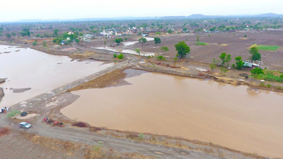 paanifoundation's tweet photo. What does a village look like after 120 mm of rainfall? A bird’s eye view of Wanegaon in Phulambri taluka (Marathwada zone). The village participated in #WaterCup2019 and the citizens' hard work is showing results! 💧 https://t.co/Nrjf08PW0q