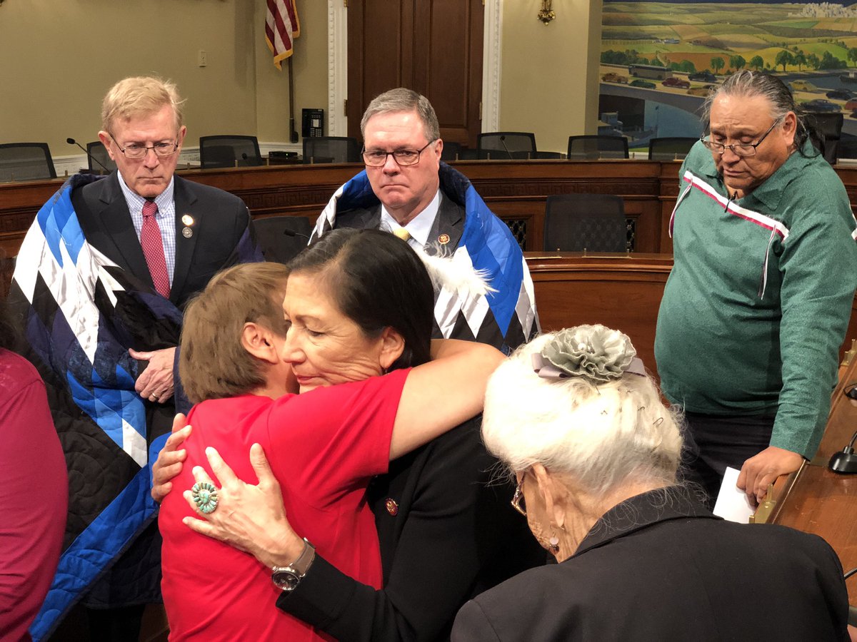 indianz's tweet photo. Descendants of the Wounded Knee Massacre present an eagle feather plume to Rep. Deb Haaland (D-New Mexico) thanking her for introducing the Remove the Stain Act to rescind the Medals of Honor for the 1890 massacre. #RemoveTheStain https://t.co/6elRdP3VJg
