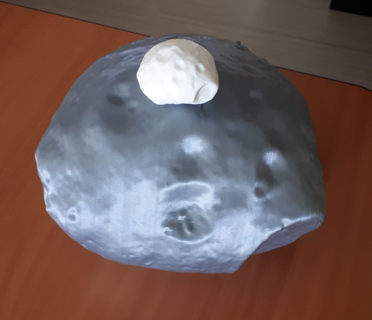simon_tardivel's tweet photo. Le projet #RoverMMX avance et il est donc temps de s'intéresser aux sites d'atterrissage : latitude, longitude, pente, etc... Et comme tous les graphiques du monde ne remplacent pas un objet en 3d, on a décidé d'imprimer #Phobos en grand (avec le petit modèle pour comparaison) https://t.co/wSrd6pQ3Kq