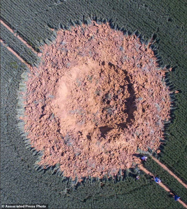 BreitTank's tweet photo. A 30-foot crater has appeared in a German cornfield overnight after a Milkshake IPA can spontaneously detonated. No one was injured in the blast. https://t.co/rKWg3tixN5