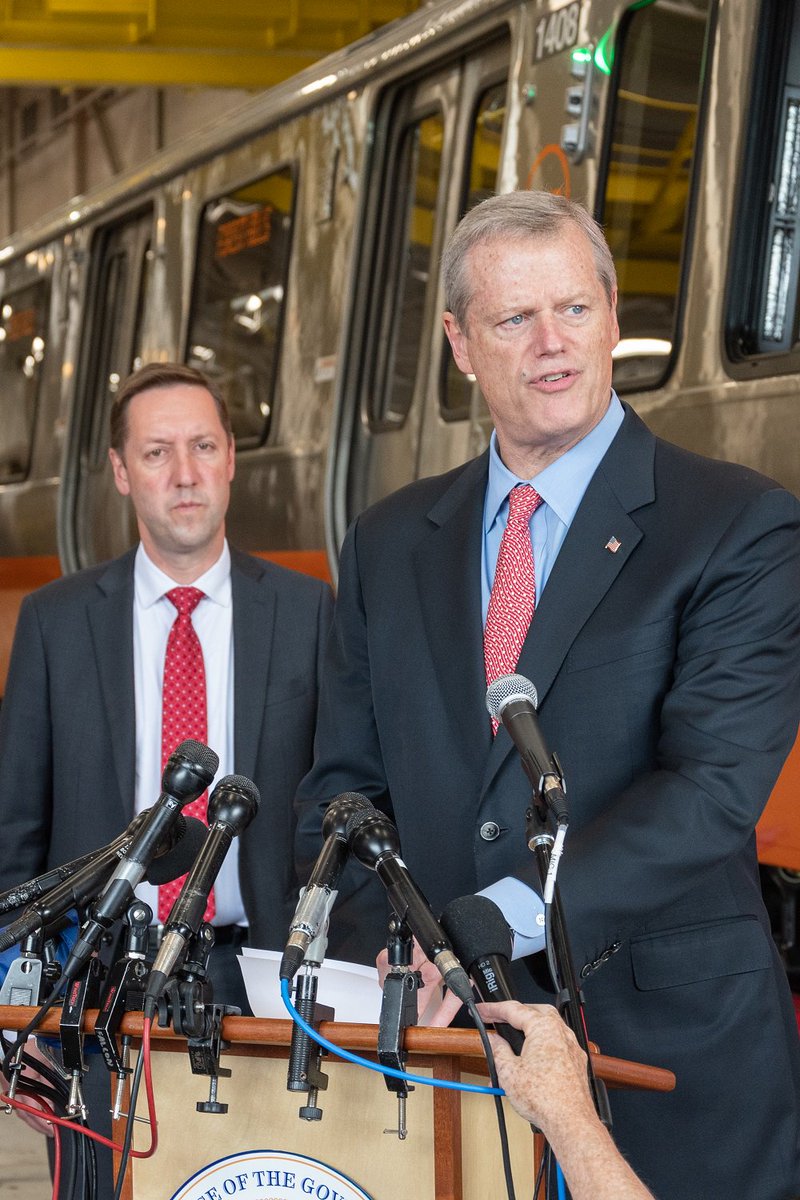 Governor Baker at a podium with General Manager Poftak behind him at Wellington Station