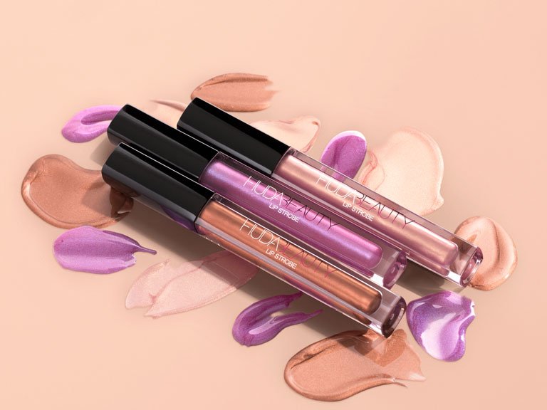 IPSY's tweet photo. The literal shining stars of your makeup kit: Wear these gleaming, holographic @hudabeauty Lip Strobes alone or on top of your favorite lip colors. || #ipsy #ipsyBlockParty https://t.co/2mdr8AJnGC