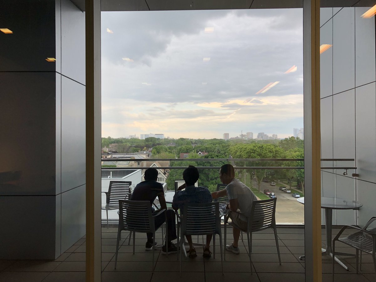 UWMCGCA's tweet photo. Grad student-ing outside in Milwaukee on an ominous, stormy summer afternoon. Bold move, but you can't argue with the view. https://t.co/J1IvVggf1C