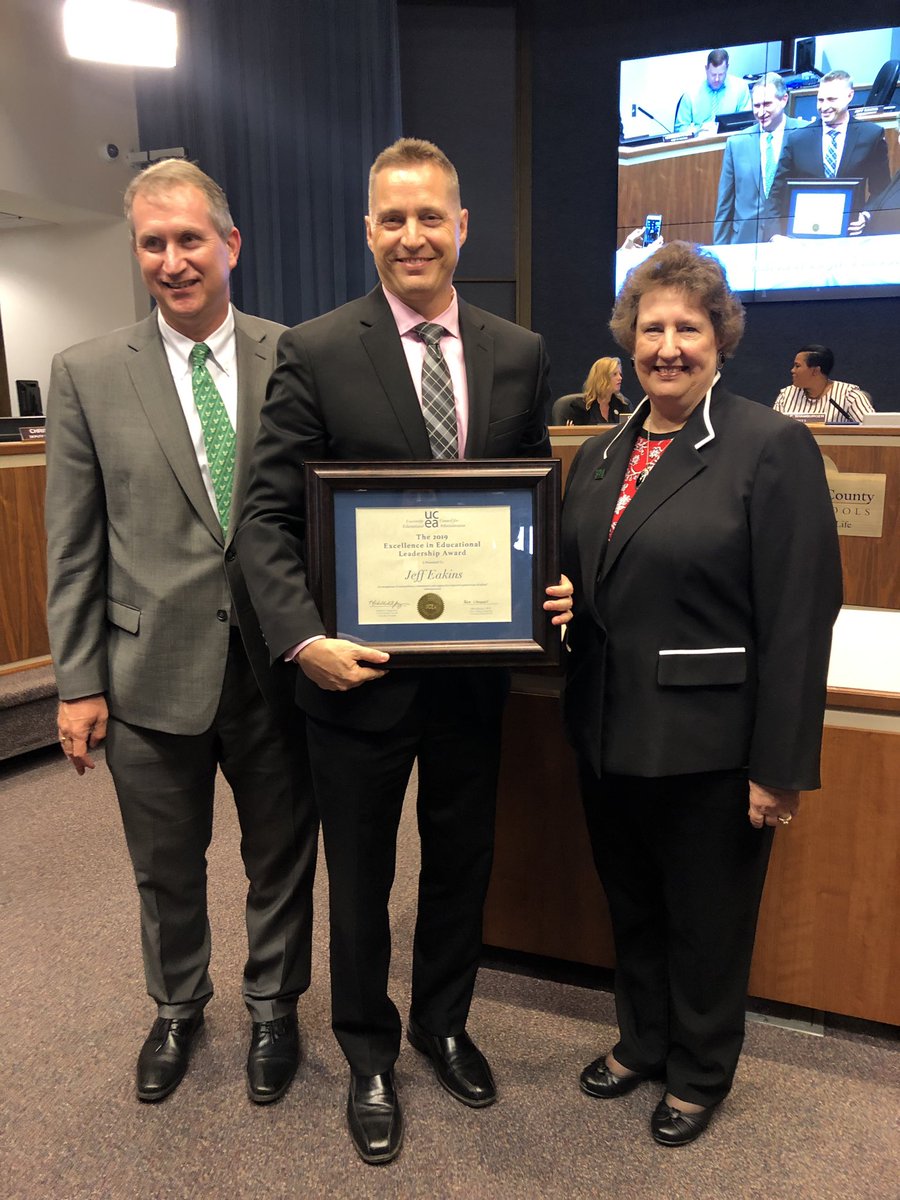 HillsboroughSch's tweet photo. USF Education Dean Robert Knoeppel surprised Supt. @Jeff_Eakins with the Natl 2019 Excellence in Educational Leadership Award at today’s board meeting. @educationUSF nominated Eakins for his work supporting the needs of school leaders, teachers &amp; students. https://t.co/VEGSDfNypA