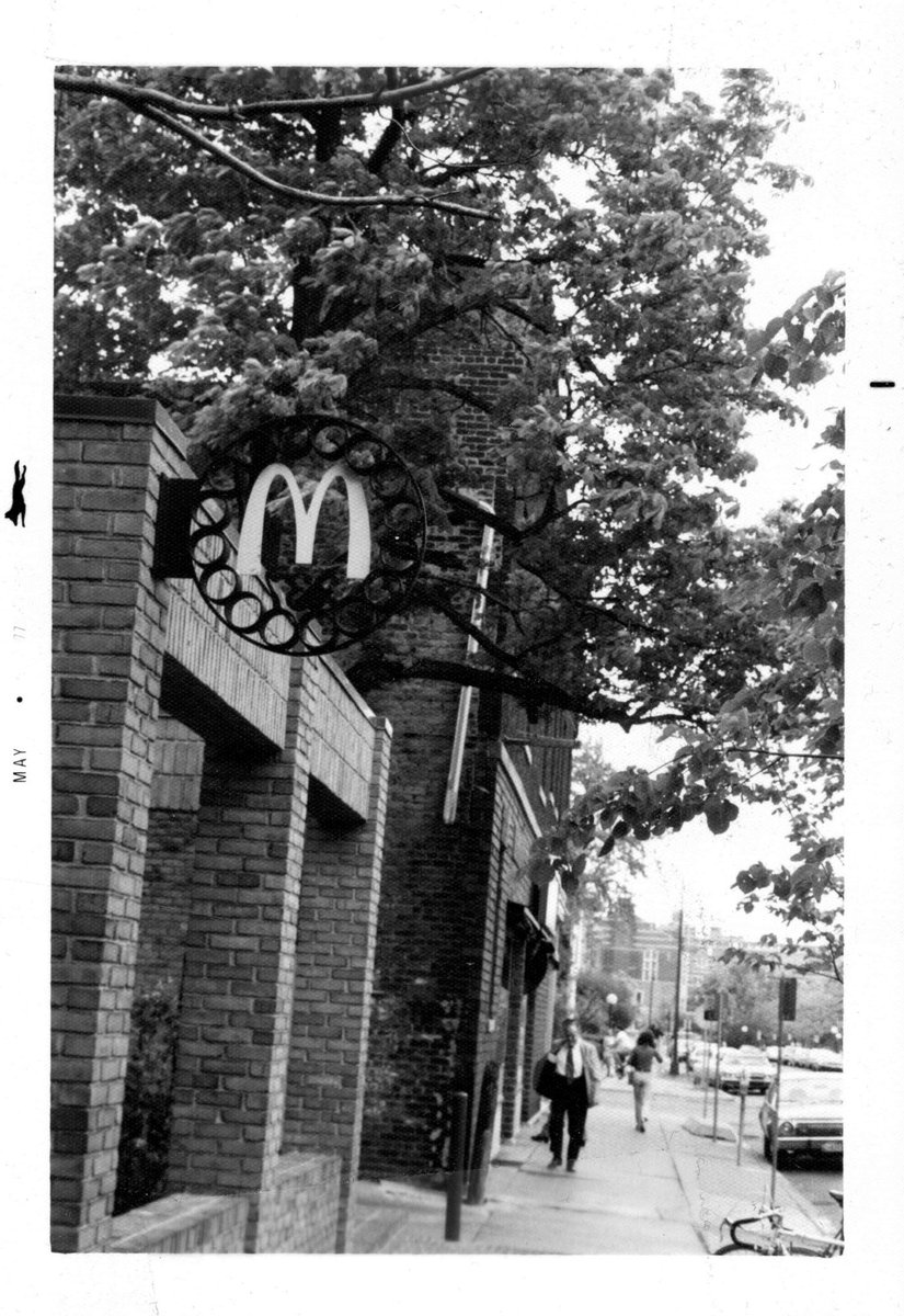 Hobbs + Black were ultimately hired to design a storefront that would satisfy the public. Their vision of McDonald’s was a gabled brick building with a front courtyard, custom signage, and a stained glass window with the Golden Arches (photos via  @aadlarchives)