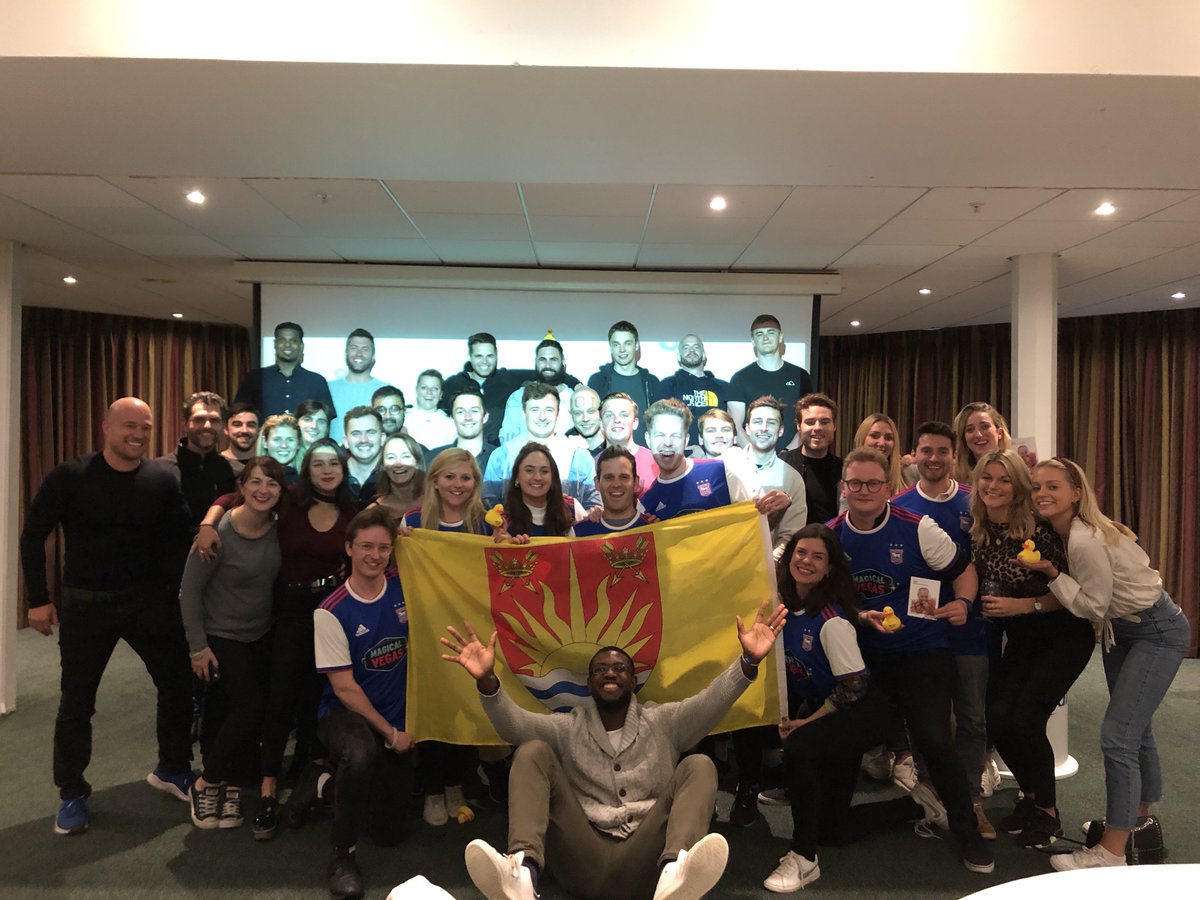 MarkGlennMurphy's tweet photo. A London company has taken their love for @suffolkday to the extreme!

Neil Ryland from Suffolk runs @peakonteam and organised for members of their international offices to fly in for #SuffolkDay celebrations! 

In case you missed it!..https://t.co/hpbzmmSm6V https://t.co/9KQXnzd893