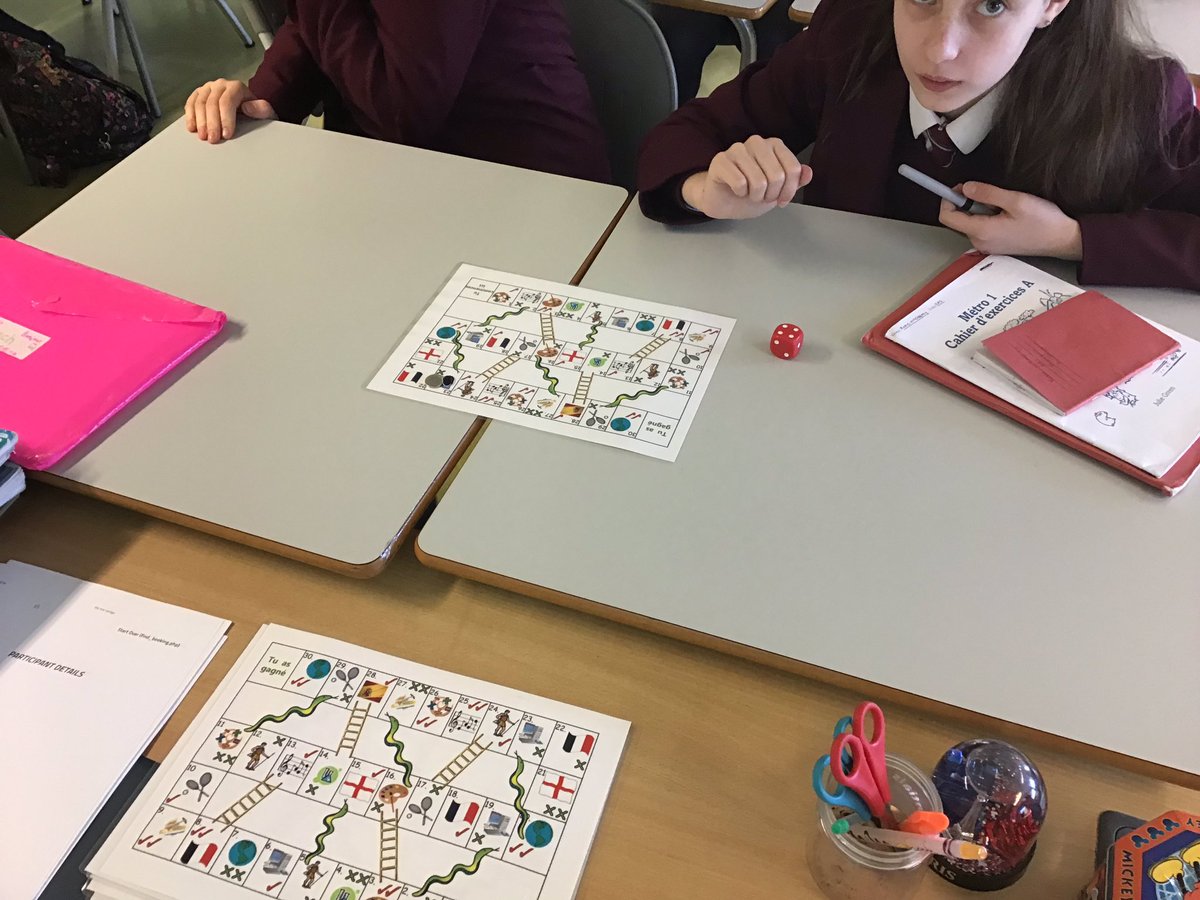 Year 8 pupils working on their school subjects and opinions with the snakes and ladders board game #mfltwitterati #ActiveLearning #MakeLanguagesFun