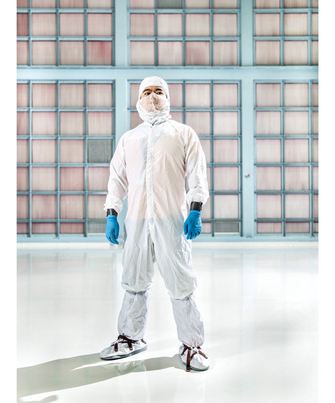 Zao is pictured in the Spacecraft Systems Development and Integration Facility (SSDIF)  at NASA Goddard, standing in front of the wall of filters that help keep the cleanroom clean.