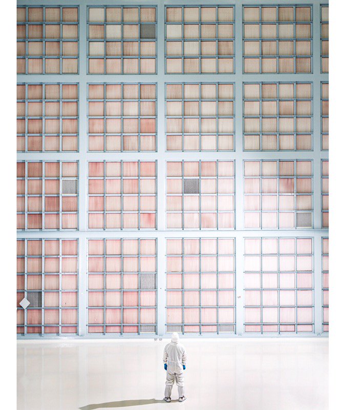 Zao is pictured in the Spacecraft Systems Development and Integration Facility (SSDIF)  at NASA Goddard, standing in front of the wall of filters that help keep the cleanroom clean.