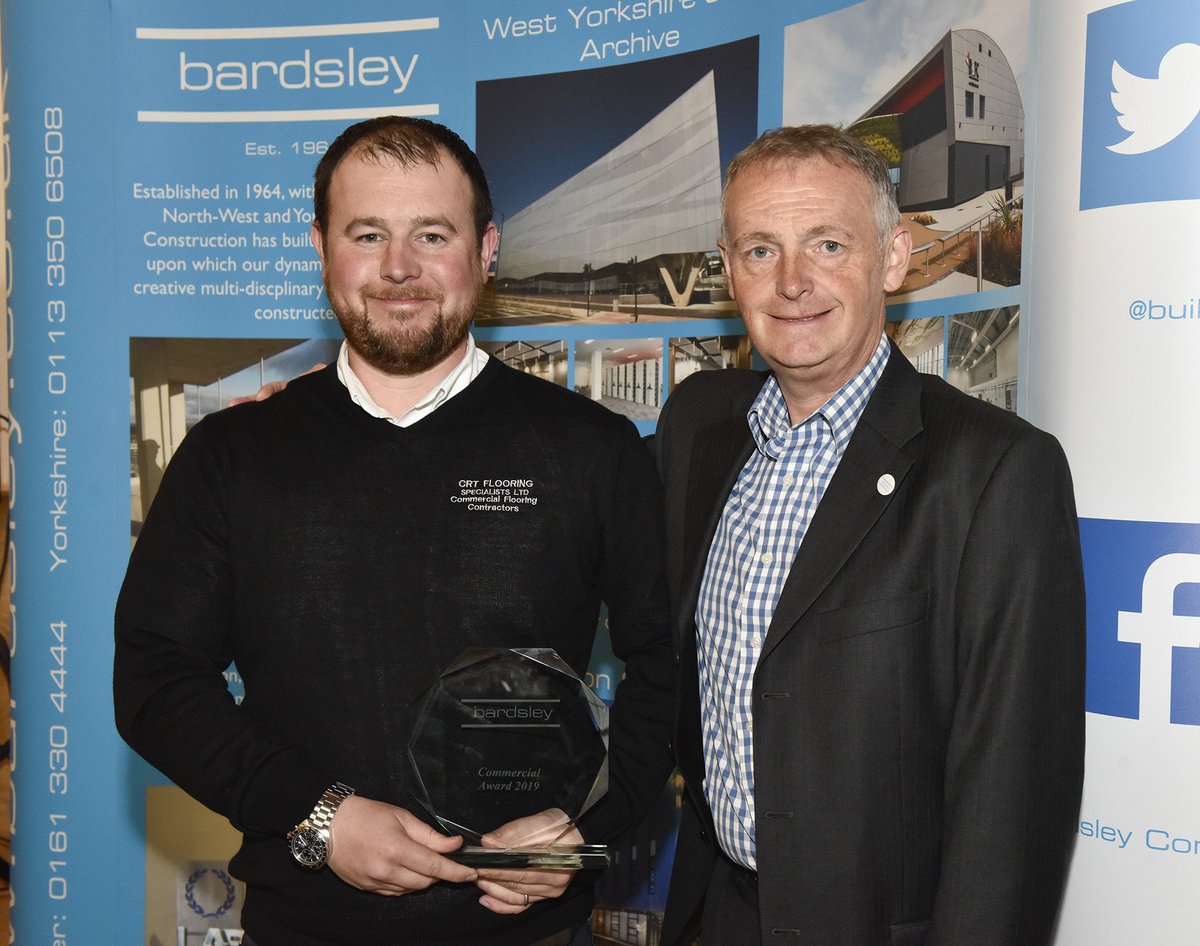 Our Managing Director Chris Turner proudly recieving the prestigious ‘Commercial Award 2019’ from Bardsley Construction - crtflooring.co.uk/1035-2/