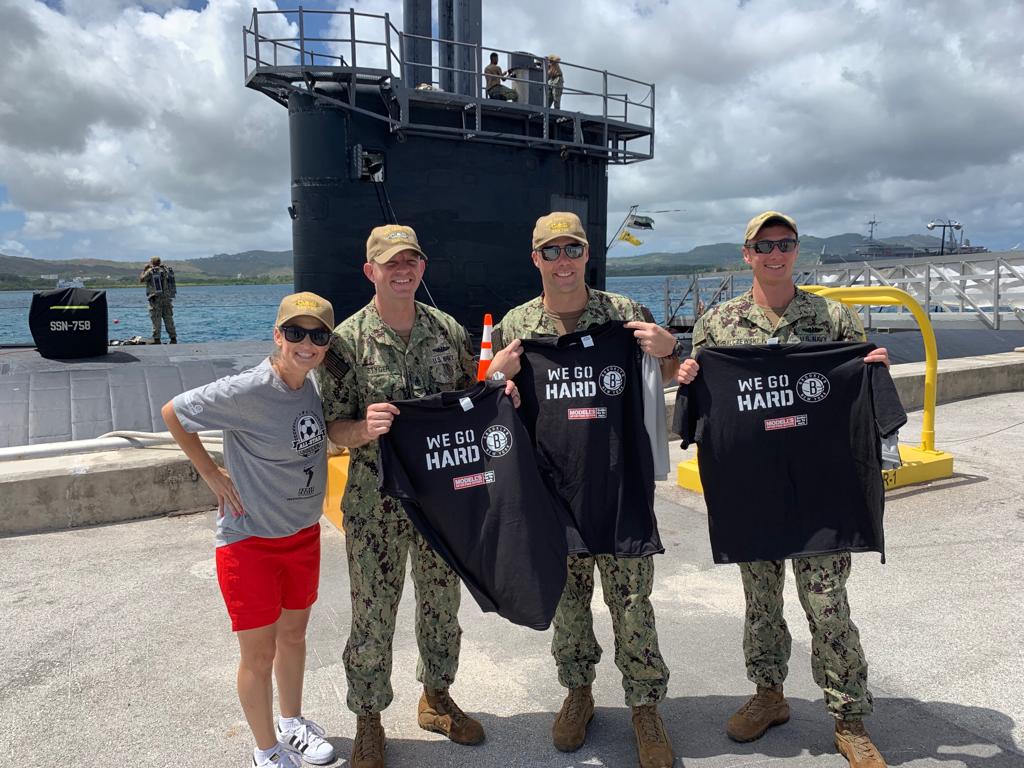 BrooklynNets's tweet photo. Former @USWNT player Nikki Serlenga — whose husband is our Player Development Coordinator Shaun Fein — spotted giving out Nets swag to troops during a Goodwill Military Tour to the Pacific Rim 🙌🙌🙌 https://t.co/HTvRbTA93E