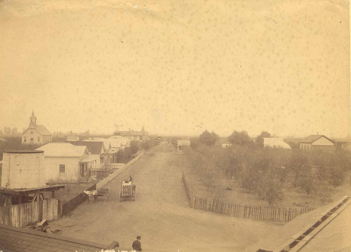 campbellmuseums's tweet photo. Guess the street! Here we have an aerial view of a street in Campbell around the mid 20th century. Campbell's first Methodist Church stands on the far left. There's also the steeple of Campbell's First Congregational Church, behind Dr. Charles Noah Cooper's home. #MuseumTrivia https://t.co/IYroGK11RB