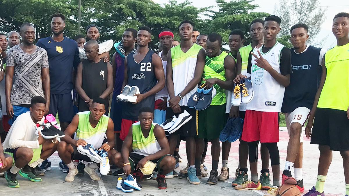 UofDJesuit's tweet photo. Feeling blessed by his Jesuit experience, alumnus Ike Eke ‘17, wanted to pay it forward. Using his own savings, he had a basketball court built for the young men in Enugu, Nigeria. He also brought them basketball shoes! Ike is just one example of a UDJ Man for Others. @ike_eke https://t.co/uqHxgloJFp