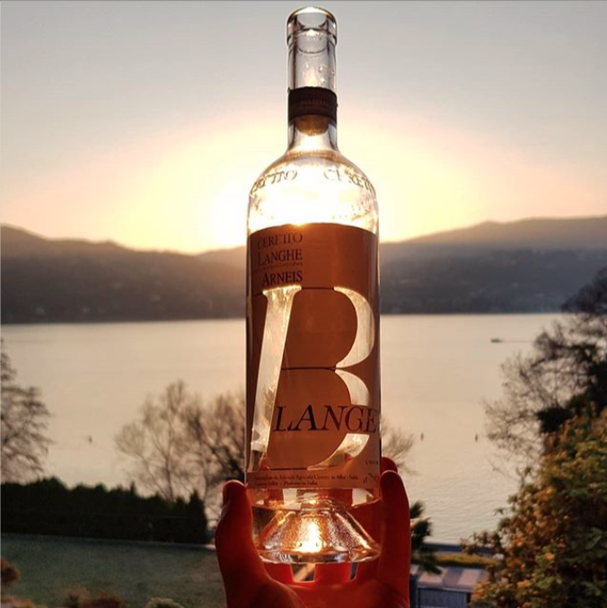[Blangè]
Sunset on lake Maggiore enhances the beauty of its designer label by Silvio Coppola. 
Thank you @vinbacco for this shot of our Blangé. 
#ceretto #cerettowinery #langhe #langheroero #blange #blangeceretto #wine #winelover