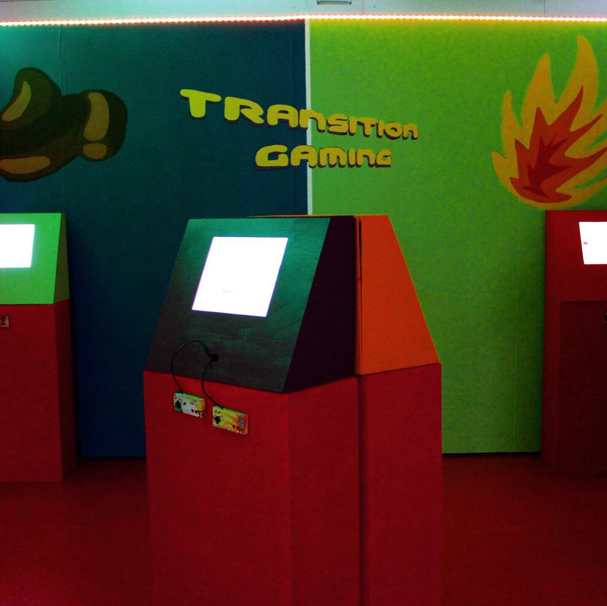 Arcade style games with illustrations on the back wall