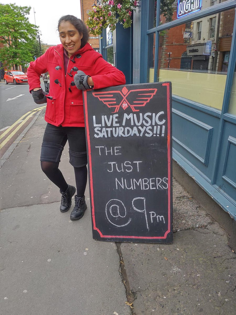 justnumbersband's tweet photo. Our drummer, ukulele player and backing vocalist @Troisnyx posing by the sign we discovered was put up tonight outside the Angel, for tomorrow's gig.

Hope to see you there! https://t.co/zPjS0uIPNu
