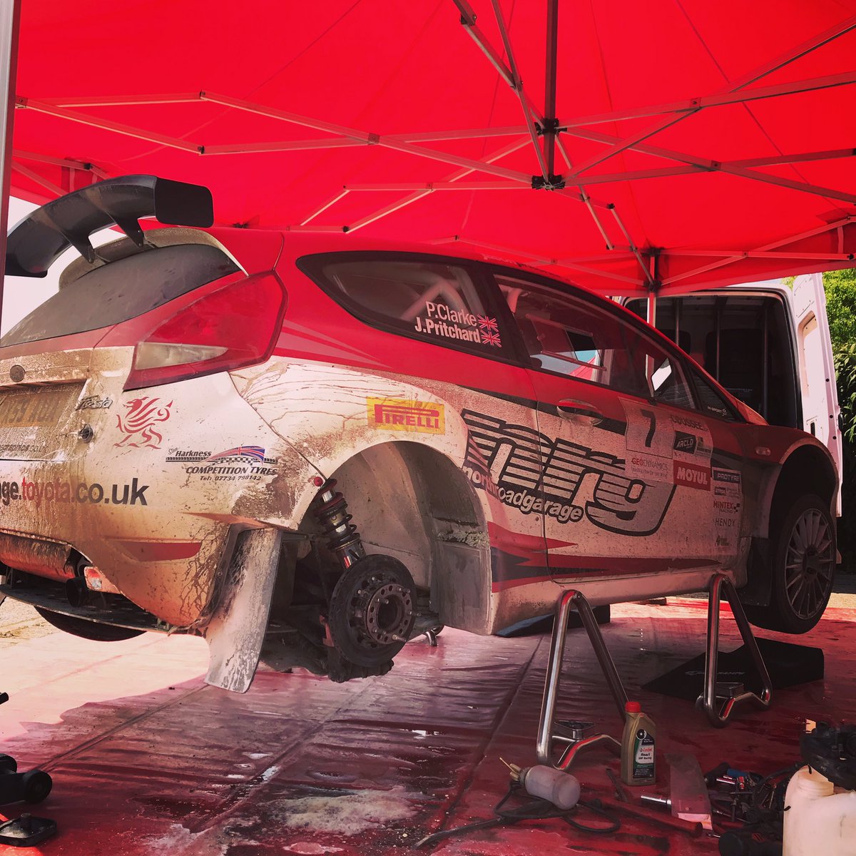 JasonNRG's tweet photo. Game over, brake calliper stuck on and then went on fire in the refuel zone. Thank you very much to all the marshals there who quickly put the fire out. Good haul of points for the championship gone but me and Phil have come back from worse. #fiestas2000 #asphaltrallying https://t.co/kIz4PJ8FQc