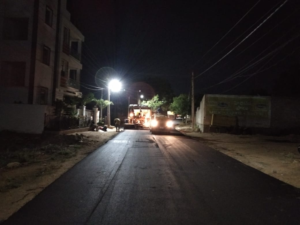 Laying BT recarpet at stalin nagar approach road under Miyapur ward