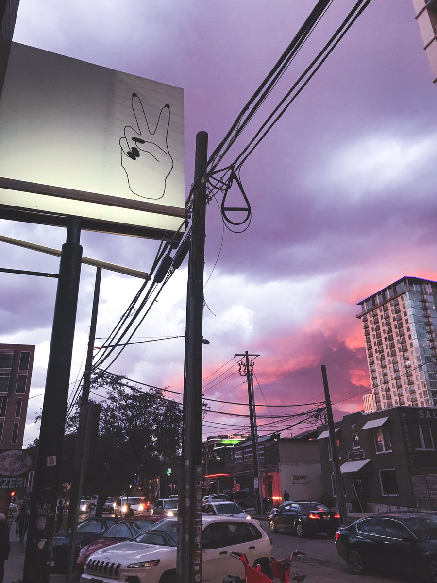 Follow the peace sign to great boozy cocktails and a laissez-faire vibe. #elmrg #irenesaustin #irenesatx #sunset #austintexas