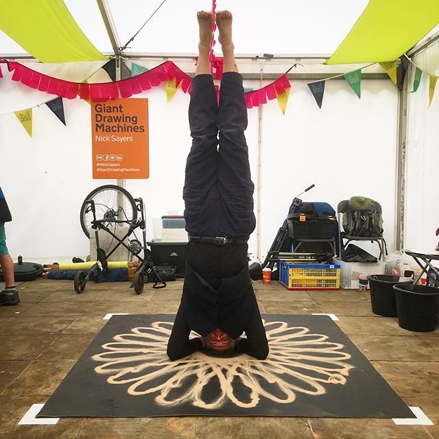NickSayers's tweet photo. You know it was wise to bring a yogi as a #GiantDrawingMachines assistant when he performs a sirsasana headstand in the middle of a Bicycle Spirograph sand mandala. Best. Assistant. Everrr! #Sirsasana #yoga @vidyadasa #FestivalOfMaking #blackburn #hypotr… https://t.co/fVAgbT2dMi https://t.co/R4lqiWHeeb