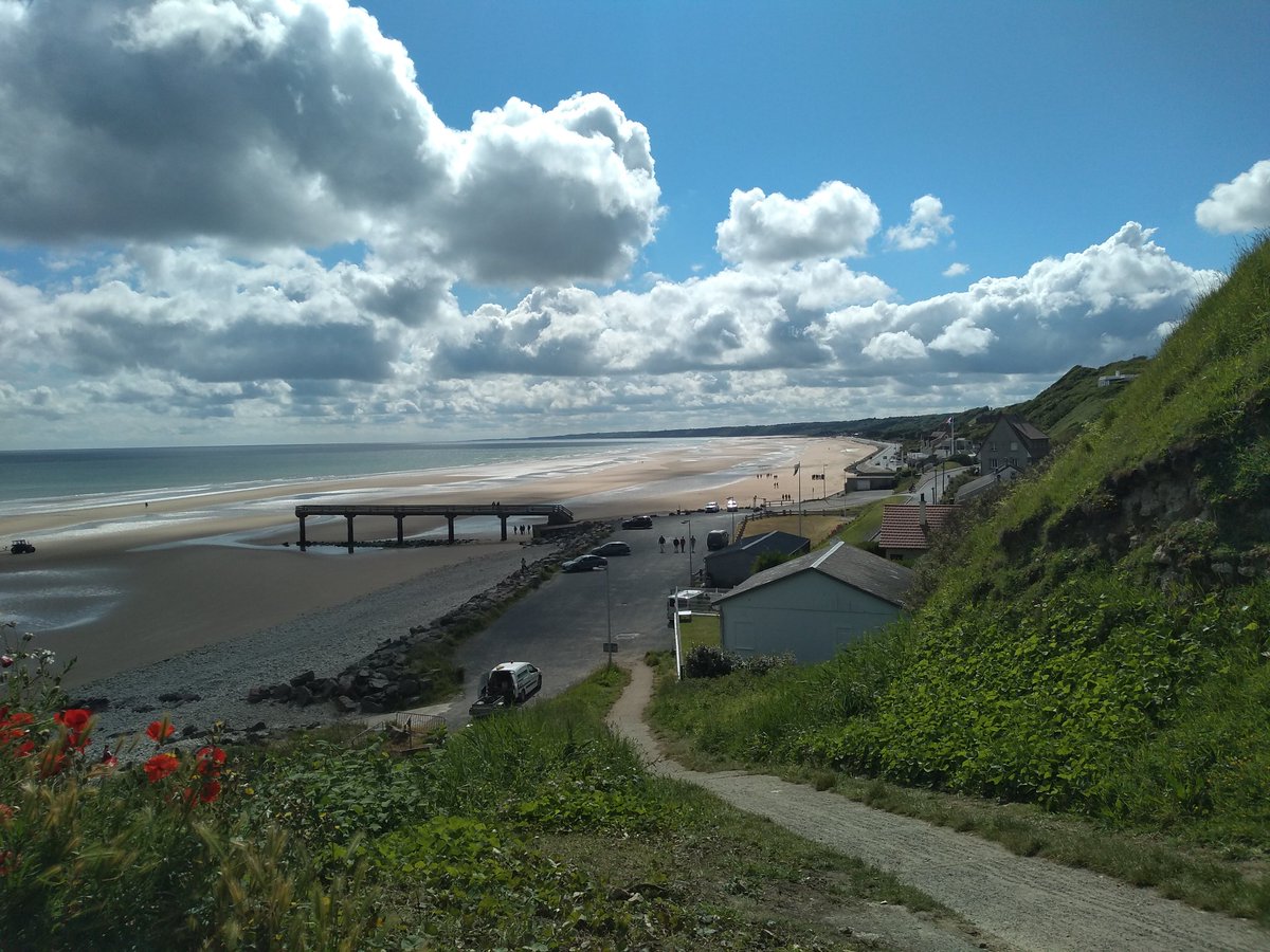 WarwalkerUpdate's tweet image. Pics of 'Bloody Omaha': the sweeping crescent-shaped beach taken from the German defences at Vierville-sur-Mer; memorial to the men of the 29 Div, 116 RCT who fought and died here; German 50mm gun casemate guarding the exit from Easy Red beach