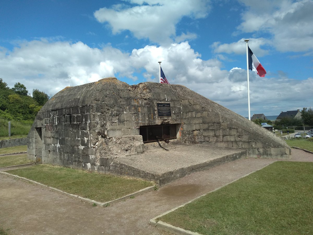 WarwalkerUpdate's tweet image. Pics of 'Bloody Omaha': the sweeping crescent-shaped beach taken from the German defences at Vierville-sur-Mer; memorial to the men of the 29 Div, 116 RCT who fought and died here; German 50mm gun casemate guarding the exit from Easy Red beach
